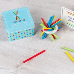 Wooden pick up sticks in a tin