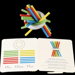 Wooden pick up sticks in a tin